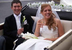 Bride and groom in car