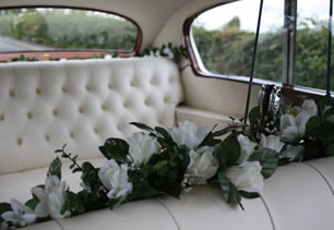 Flowers and seating inside wedding car