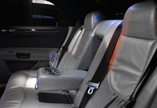 Rear seating and armrest in limousine